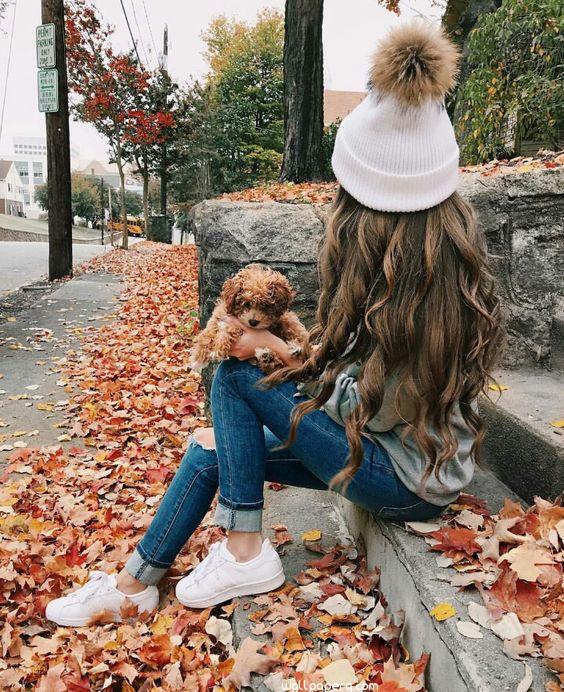 Girl in autumn with her bear image