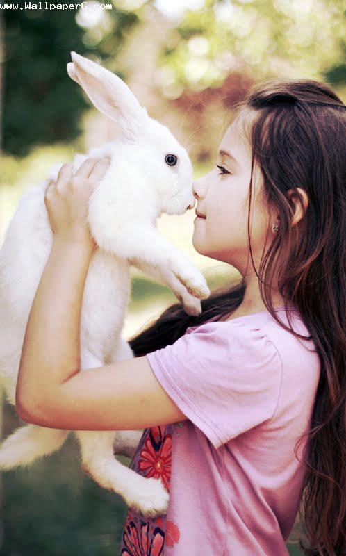 Girl playing with rabbit