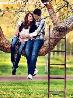 Boy and girl romancing on tree