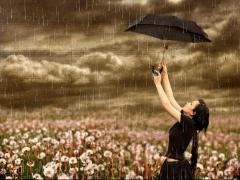 Rainy season girl enjoy with umbrella