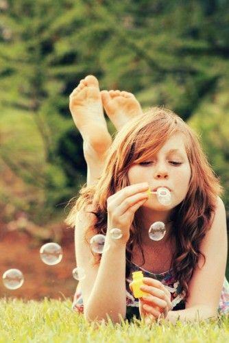 Girl playing with bubbles