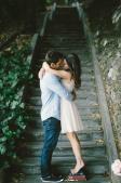 Romantic couple loving along the stairs wallpaper