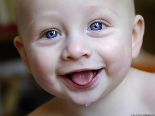 Cute baby smiling and tea