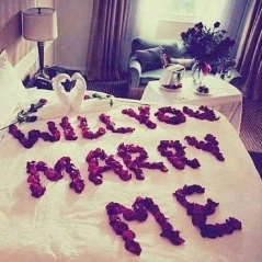 Will you marry me write on bed