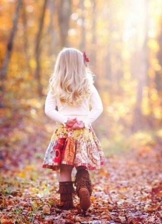 Girl walking on leaves