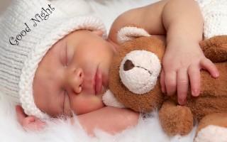 Baby with teddy good nigh