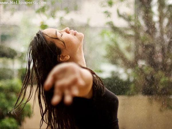 Girl enjoying monsoon image