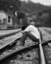 Emo boy at rail track