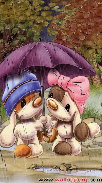 Two couples under an umbrella