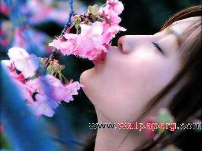 Girl kissing flower